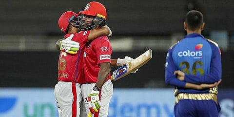 Kings XI Punjab players Mayank Agarwal and Chris Gayle celebrate after winning their Indian Premier League T20 match against Mumbai Indians. (Photo | PTI)