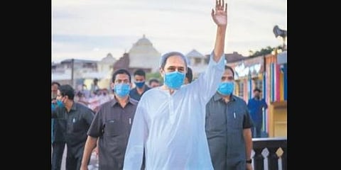 Odisha CM Naveen Patnaik waves to people during his visit to Puri. (Photo | EPS)