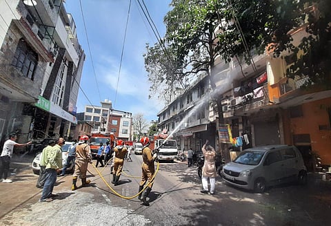 Delhi Fire service staff sanitize the Bhogal area near Nizamuddin in New Delhi. (Photo | Shekhar Yadav/EPS)