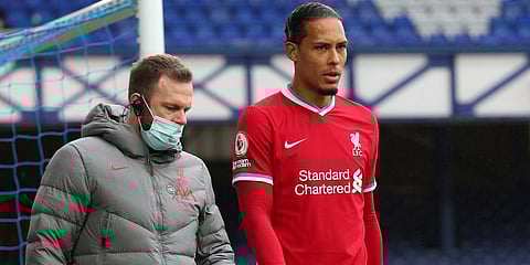 Liverpool defender Virgil van Dijk leaves the match with an injury during the EPL match against Everton at Goodison Park Stadium. (Photo | AP)