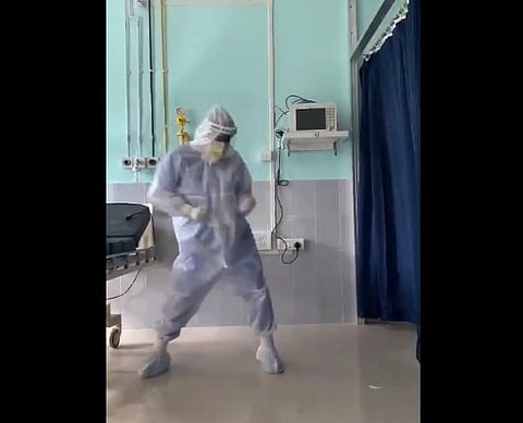 Dr Arup Senapati an ENT surgeon at Silchar medical college Assam, grooving to 'Ghungroo' in his PPE kit. (Photo | Twitter screengrab)