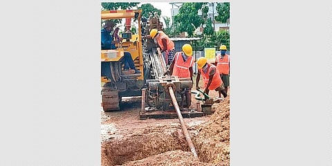 Workers laying a pipeline for  the city gas supply project