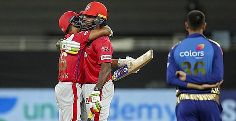 Kings XI Punjab players Mayank Agarwal and Chris Gayle celebrate after winning their Indian Premier League (IPL) T20 cricket match against Mumbai Indians (MI). (Photo | PTI)