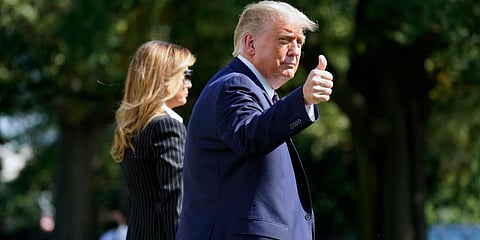 US President Donald Trump and first lady Melania Trump walk to board Marine One at the White House. (File photo| AP)