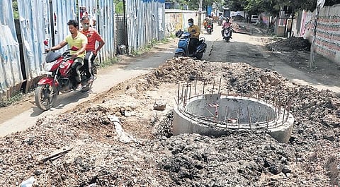 Motorists struggling to negotiate the dug-up Mada Kovil Street, Nerkundaram, on Thursday | Bala sai RH