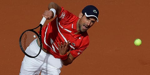 Novak Djokovic serves against Ricardas Berankis in the second round match of the French Open tournament at the Roland Garros stadium in Paris. (Photo | AP)