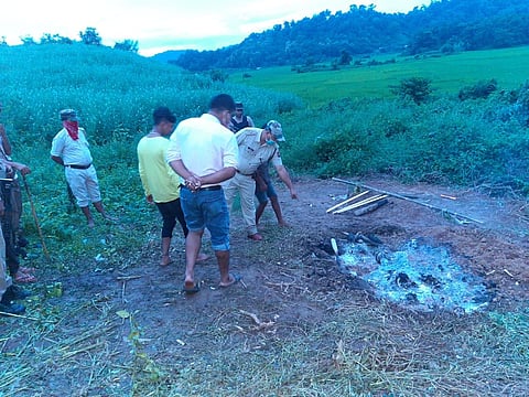 Cops and villagers at the suspected site of cremation (Photo | EPS)