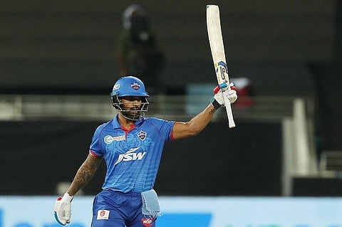Shikhar Dhawan raises his bat after scoring his consecutive century. (Photo | Twitter)