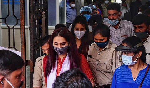 Police personnel take actors Ragini Dwivedi and Sanjjanaa Galrani out of court, after their hearing, in Bengaluru. (Photo | Shriram BN, EPS)