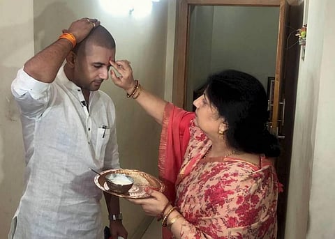 Lok Janshakti Party LJP President Chirag Paswan being blessed by his mother Reena Paswan before the inception of his election campaign in Patna. (Photo | PTI)