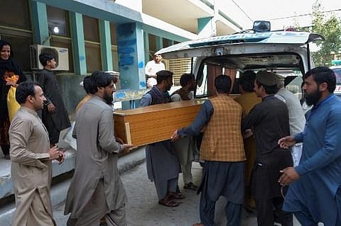 Relatives carry the coffin of a victim, who was killed in a stampede, outside a mortuary in Jalalabad on October 21, 2020. (Photo | AFP)