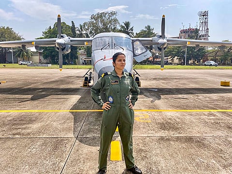 In this undated photo Sub-lieutenant Shivangi stands in front of the Dornier surveillance aircraft. (Photo | PTI)