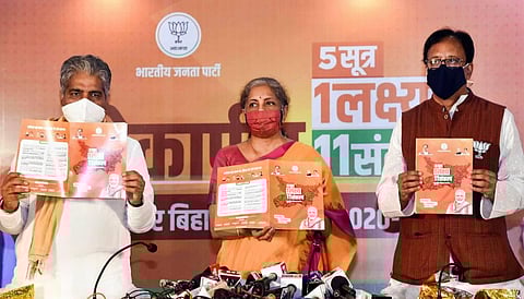 Union Finance Minister Nirmala Sitharaman along with BJP General Secretary Bhupendra Yadav and state party President Sanjay Jaiswal releases party manifesto. (Photo | PTI)