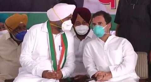 Punjab Finance Minister Manpreet Singh Badal and Rahul Gandhi (Photo | Twitter)