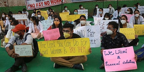 Resident doctors from the government-run hospitals take part in a demonstration demanding for their salaries to be paid on time in New Delhi. (Photo | Shekhar Yadav, EPS)