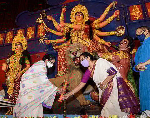 West Bengal CM Mamata Banerjee inaugurates a Durga Puja in Kolkata. (Photo| PTI)