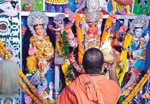 A priest performs puja before Goddess Durga in Punanga village of Jagatsinghpur. (Photo | EPS)