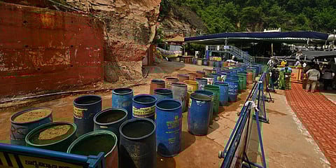 A day after boulders rolled down Vijayawada's Indrakeeladri hill, officials place water tubs adjacent to the place where landslide occurred. (Photo| Prasant Madugula, EPS)