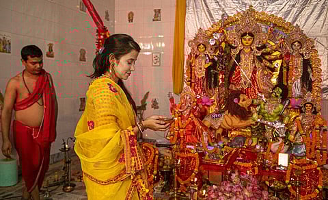 Traditional rituals like 'sandhi puja', 'kumari puja', and 'sandhya arati' were telecast on television or live streamed by organizers in view of COVID-19 protocols (Photo | AP)