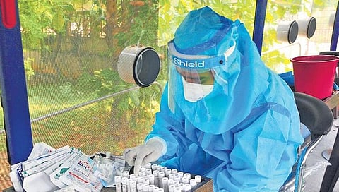 A health worker counts Covid-19 Samples in Visakhapatnam on Friday