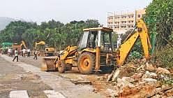 Main gate of GITAM deemed to be University being pulled down in Visakhapatnam. (Photo | G Satyanarayana, EPS)