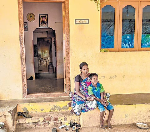 the borewell that took Sujith’s life is now filled with concrete; his mother Kalamary and brother Punith in front of their house  | Jayakumar Madala