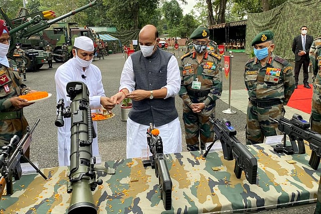 Defence Minister Rajnath Singh performed 'Shastra Puja' (worship of weapons) at a key military base in Siliguri which is responsible for guarding the Line of Actual Control (LAC) with China in the Sikkim sector. (Photo| PTI)