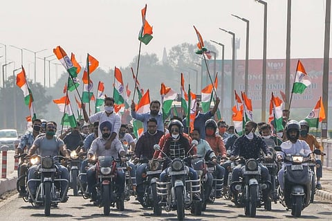BJP activists take part in a motorcycle rally on the occasion of Accession Day in Jammu Monday Oct. 26 2020. (Photo | PTI)