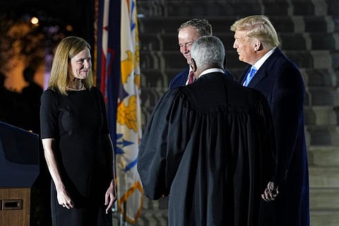 President Donald Trump watches as Supreme Court Justice Clarence Thomas finishes administering the Constitutional Oath to Amy Coney Barrett. (Photo | AP)