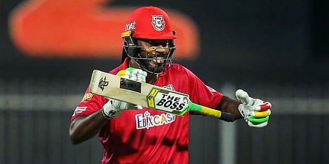 Chris Gayle of Kings XI Punjab after scoring fifty runs during IPL match against Kolkata Knight Riders in Sharjah. (Photo | PTI)