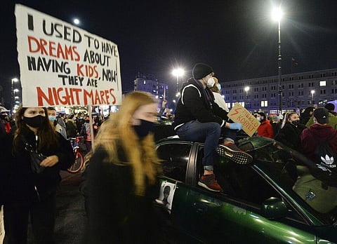 Poland's PM defends abortion ruling, condemns protests