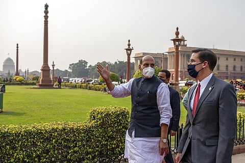 U.S. Defense Secretary Mark Esper, right, and his Indian counterpart Rajnath Singh arrive at the defense ministry for a ceremonial guard of honor in New Delhi, India. (Photo | AP)
