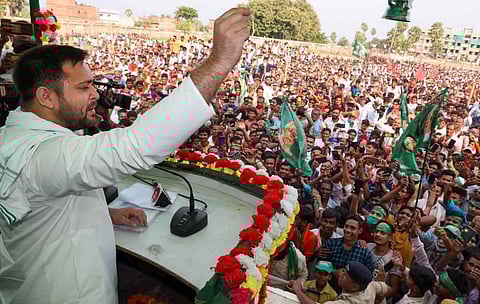 RJD leader Tejashwi Prasad Yadav addresses a gathering during an election rally for the upcoming Bihar assembly elections in Munger district. (Photo | PTI)