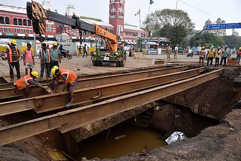 A road caved in front of MGR Central railway station in Chennai after a container lorry fell down on Monday. (Photo| R Satish Babu, EPS)