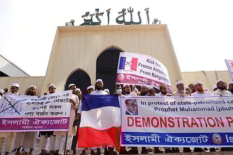 Supporters of Islami Oikya Jote, an Islamist political party, protest against the publishing of caricatures of the Prophet Muhammad they deem blasphemous, in Dhaka, Bangladesh. (Photo | AP)