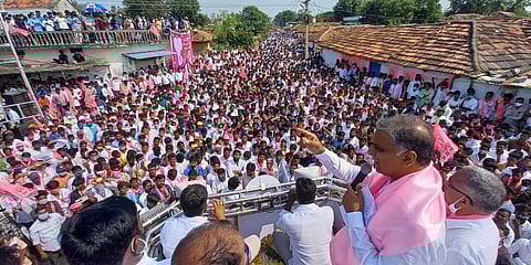 Finance Minister T Harish Rao addresses a gathering of farmers during the pink party’s poll campaign, at Chegunta mandal in Dubbaka on Wednesday. (Photo| EPS)