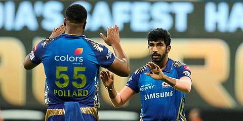 Jasprit Bumrah of Mumbai Indians celebrates the wicket of Shivam Dube of Royal Challengers Bangalore during IPL match at the Sheikh Zayed Stadium. (Photo | PTI)
