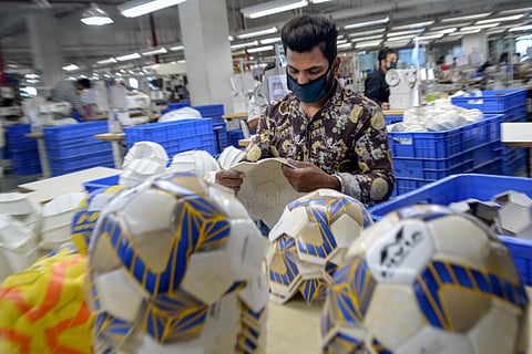 A employee makes a football at Nivia factory during the ongoing COVID-19 nationwide lockdown in Jalandhar Saturday May 16 2020. (Photo | PTI)