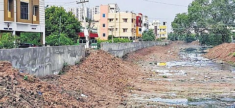 The retaining wall that is being built on both sides of the Narayanapuram-Keelkattalai lake canal | Express