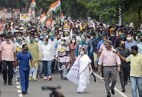 West Bengal Chief Minister Mamata Banerjee takes part in a protest rally. (Photo| ANI)