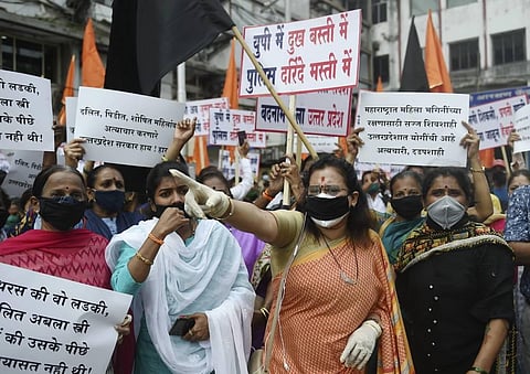 Shiv Sena party supporters shout slogans during a protest against the Uttar Pradesh government over the death of Hathras victim outside Churchgate Station in Mumbai Friday Oct. 2 2020. (Photo | PTI)
