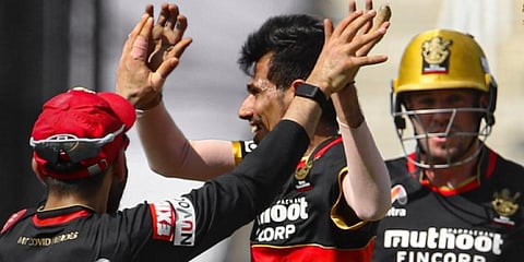 Royal Challengers Bangalore spinner Yuzvendra Chahal celebrates with teammates after picking up a wicket. (Photo | RCB Twitter)