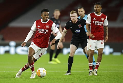 Arsenal's Joe Willock looks to pass the ball during the Europa League match. (Photo | AP)