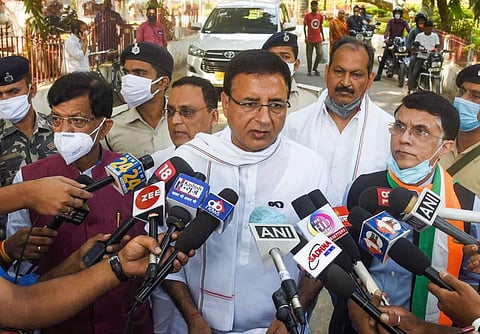 Congress General Secretary Randeep Singh Surjewala speaks to media persons on the Munger firing incident after meeting Bihar Governor Phagu Chauhan outside Raj Bhawan in Patna. (Photo | PTI)