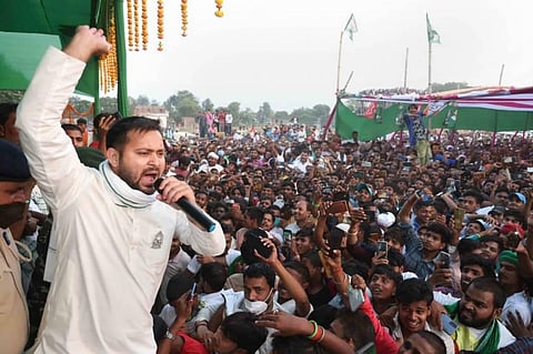 RJD leader Tejashwi Yadav addresses an election rally at Raghopur in Hajipur.. (Photo | PTI)
