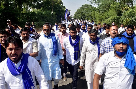 Bhim Army Chief Chandrashekhar Azad Ravan along with party workers on his way to meet the family members of the allegedly gang-raped victim, in Hathras on Sunday. (Photo | PTI)