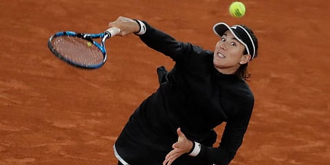 Garbine Muguruza smashes in the third round match of the French Open tournament against Danielle Collins at the Roland Garros Stadium in Paris. (Photo | AP)