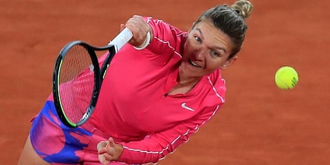 Simona Halep serves against Amanda Anisimova in the third round match of the French Open tournament at the Roland Garros Stadium in Paris. (Photo | AP)