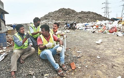 Janarthanan, Gowtham Alibasha and Thirunavukkarasu working at Corporation Composting Center at Tiruvotriyur in Chennai | ASHWIN PRASATH