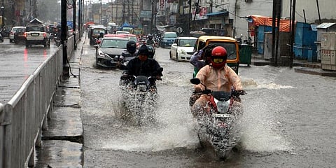 Vehicles on a flooded Cuttack-Puri road in Bhubaneswar. (Photo | Irfana, EPS)